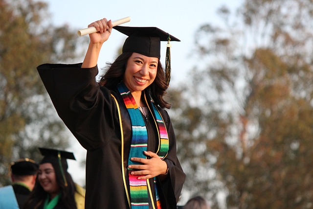 Graduates celebrating with Canadian flag